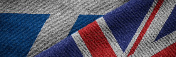 The image shows the Scottish and UK flags overlapping