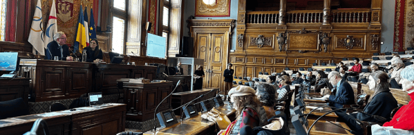 Photograph of Jackson Carlaw MSP and Paris City Council Vice Mayor addressing the Paris Citizen's Assembly in the Hotel de Ville in Paris during an Assembly Plenary meeting in March 2023