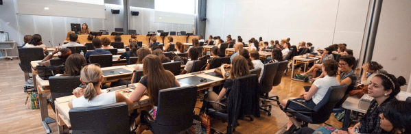 Picture shows students in lecture theatre.