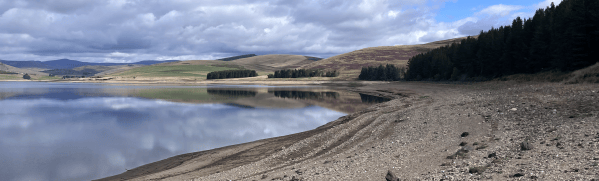 Image showing low water levels at Backwater reservoir, north west Angus, Scotland.